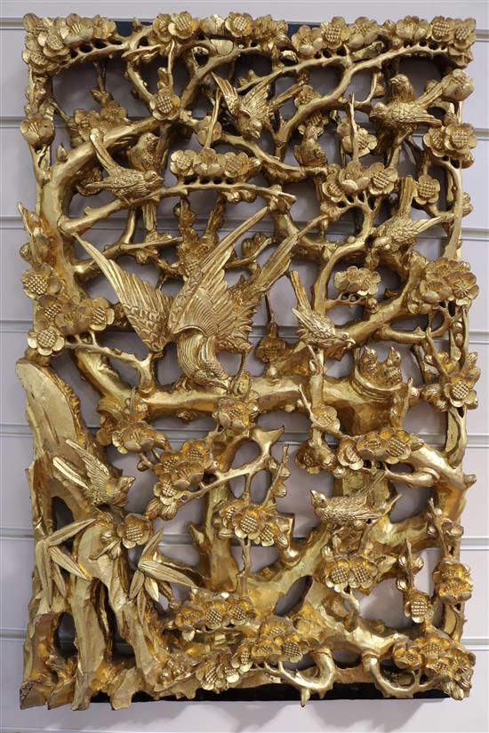 A set of six Chinese carved giltwood panels of birds amid prunus